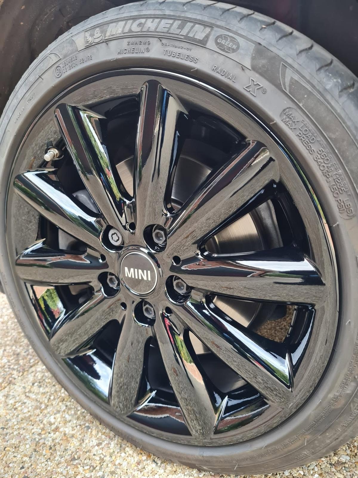 MINI alloy wheel refinished in black after refurbishment