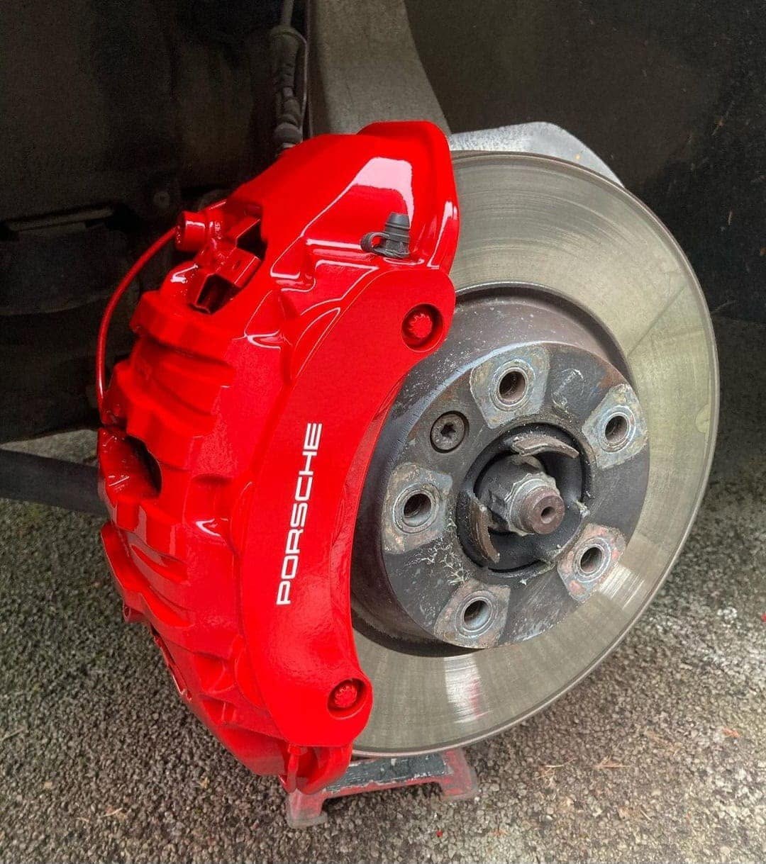 The same Porsche brake caliper after painting in red by WheelMaster